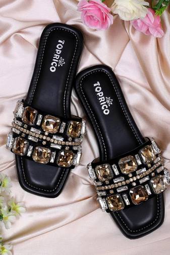 Black champagne embellished faux leather slip-on flats for women