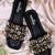 Black champagne embellished faux leather slip-on flats for women