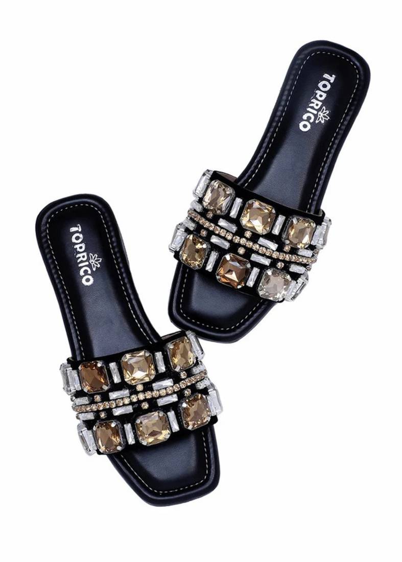 Black champagne embellished faux leather slip-on flats for women