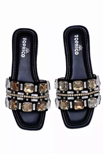 Black champagne embellished faux leather slip-on flats for women