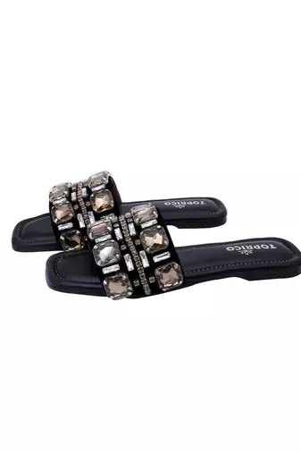 Black champagne embellished faux leather slip-on flats for women