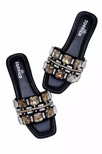 Black champagne embellished faux leather slip-on flats for women