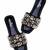 Black champagne embellished faux leather slip-on flats for women