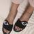 Black beaded faux leather evil eye flats for women