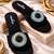 Black beaded faux leather evil eye flats for women