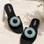 Black beaded faux leather evil eye flats for women