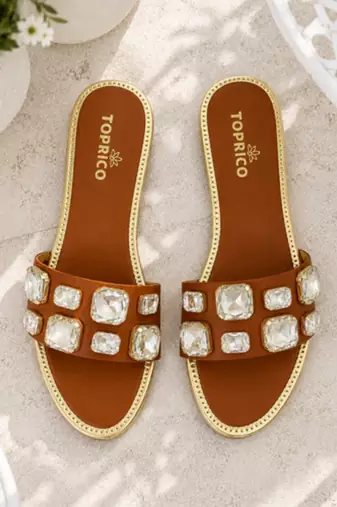 Tan crystal embellished faux leather slip-on flats for women