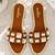 Tan crystal embellished faux leather slip-on flats for women