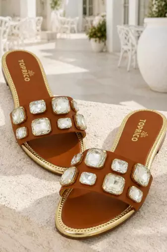 Tan crystal embellished faux leather slip-on flats for women