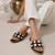 Black crystal embellished faux leather slip-on flats for women