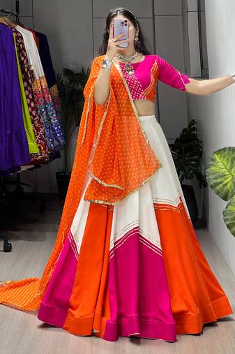 navratri collection white & orange flared lehenga set  pink bandhani blouse & dupatta - full stitched free size