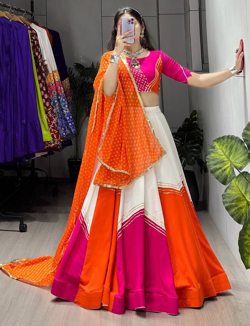 navratri collection white & orange flared lehenga set  pink bandhani blouse & dupatta - full stitched free size