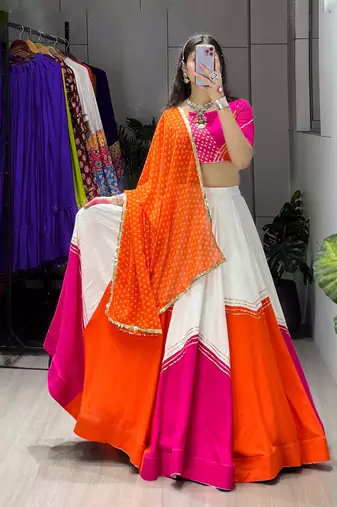 navratri collection white & orange flared lehenga set  pink bandhani blouse & dupatta - full stitched free size