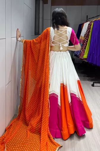 navratri collection white & orange flared lehenga set  pink bandhani blouse & dupatta - full stitched free size