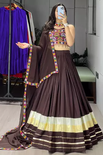 deep brown flared navratri lehenga choli with metallic zari borders & shell tassels - full stitched free size