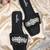 Black crystal embellished faux leather slip-on flats for women
