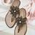 Gold beaded faux leather flower t-strap flats for women
