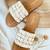 Tan shell embellished faux leather flats for women