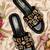 Black crystal embellished faux leather wedge heels for women