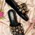 Black crystal embellished faux leather wedge heels for women