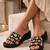 Black crystal embellished faux leather wedge heels for women