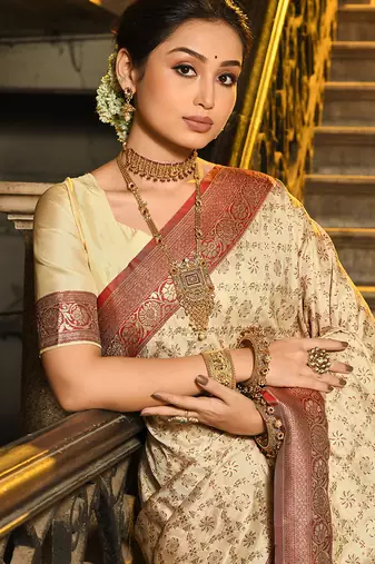 Cream banarasi silk blend saree with red zari border