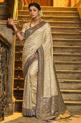 Cream banarasi silk blend saree with navy blue zari border