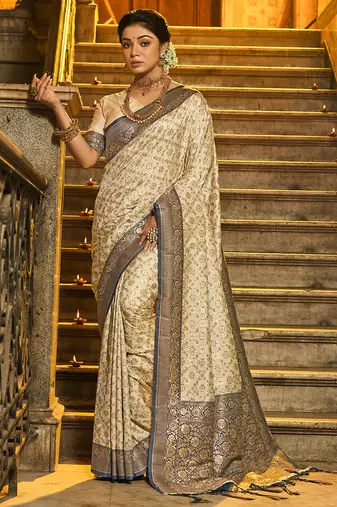 Cream banarasi silk blend saree with navy blue zari border