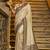 Cream banarasi silk blend saree with navy blue zari border