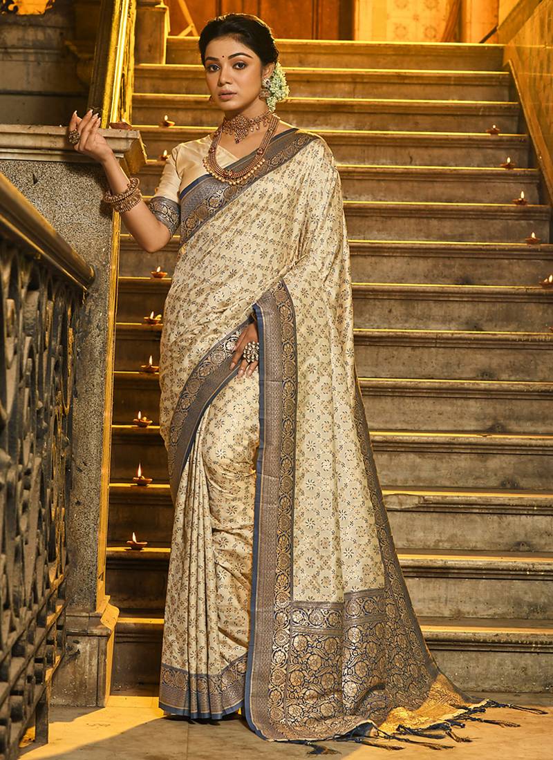 Cream banarasi silk blend saree with navy blue zari border