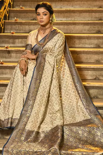Cream banarasi silk blend saree with navy blue zari border
