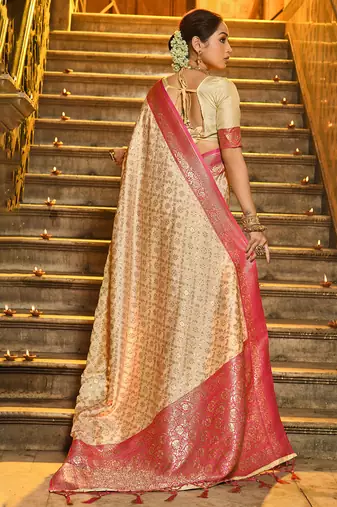Cream banarasi silk blend saree with rani pink zari border