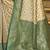 Cream banarasi silk blend saree with sea green zari border