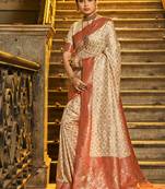 Cream banarasi silk blend saree with red zari border
