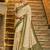 Cream banarasi silk blend saree with dark green zari border