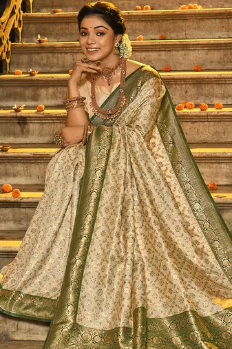Cream banarasi silk blend saree with dark green zari border