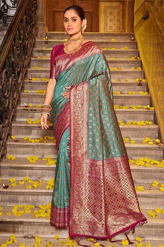 Teal blue banarasi silk blend saree with magenta zari border