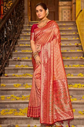 Peach banarasi silk blend saree with rani pink zari border