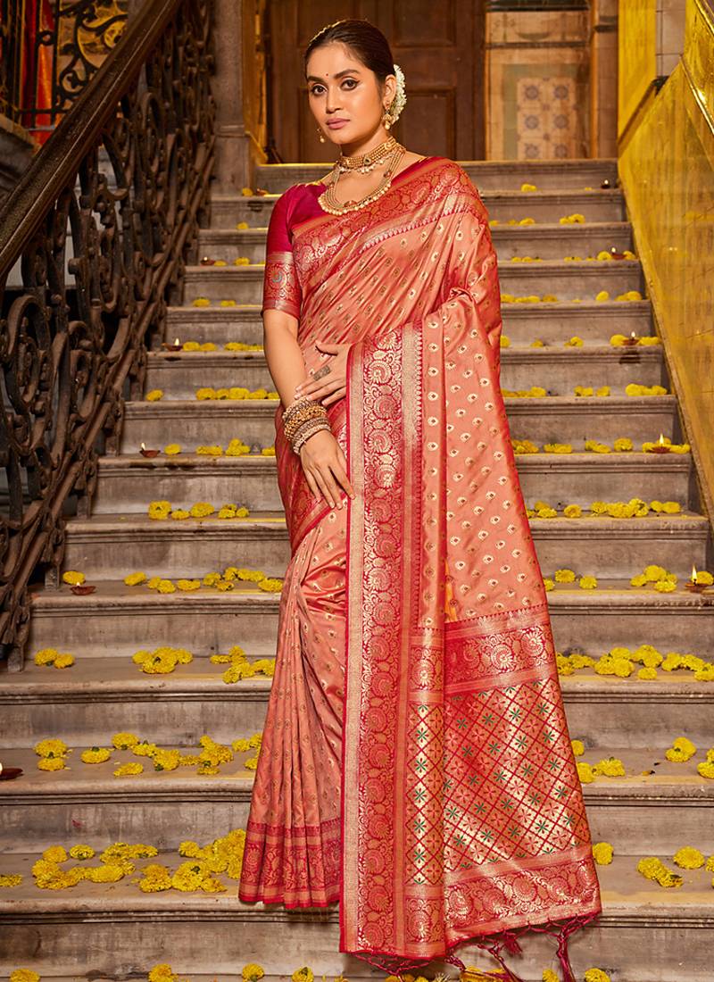 Peach banarasi silk blend saree with rani pink zari border
