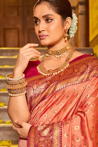 Peach banarasi silk blend saree with rani pink zari border