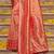 Peach banarasi silk blend saree with rani pink zari border