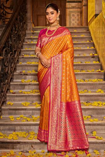 Orange banarasi silk blend saree with magenta zari border