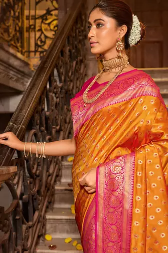 Orange banarasi silk blend saree with magenta zari border