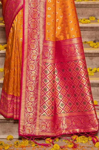 Orange banarasi silk blend saree with magenta zari border