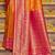 Orange banarasi silk blend saree with magenta zari border