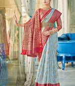 Sky blue & red linen cotton blend saree with rich zari woven border