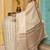 Off white woven linen silk saree with gold zari border