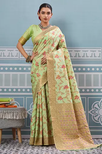 Light pistachio green banarasi silk blend saree with rich gold zari floral weaving