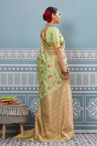 Light pistachio green banarasi silk blend saree with rich gold zari floral weaving