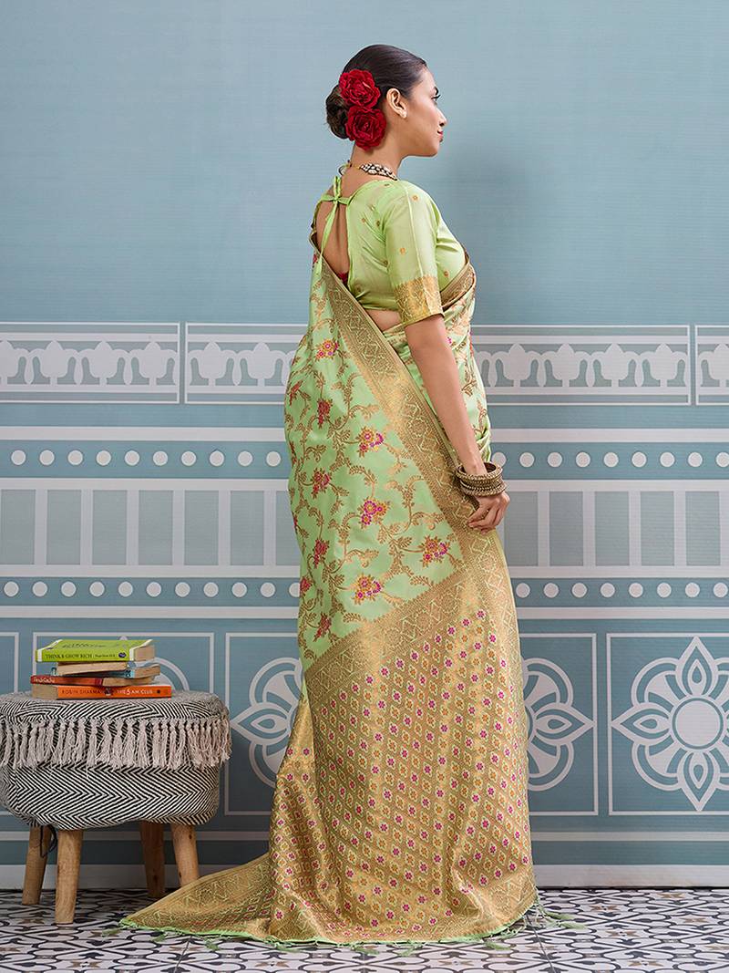 Light pistachio green banarasi silk blend saree with rich gold zari floral weaving